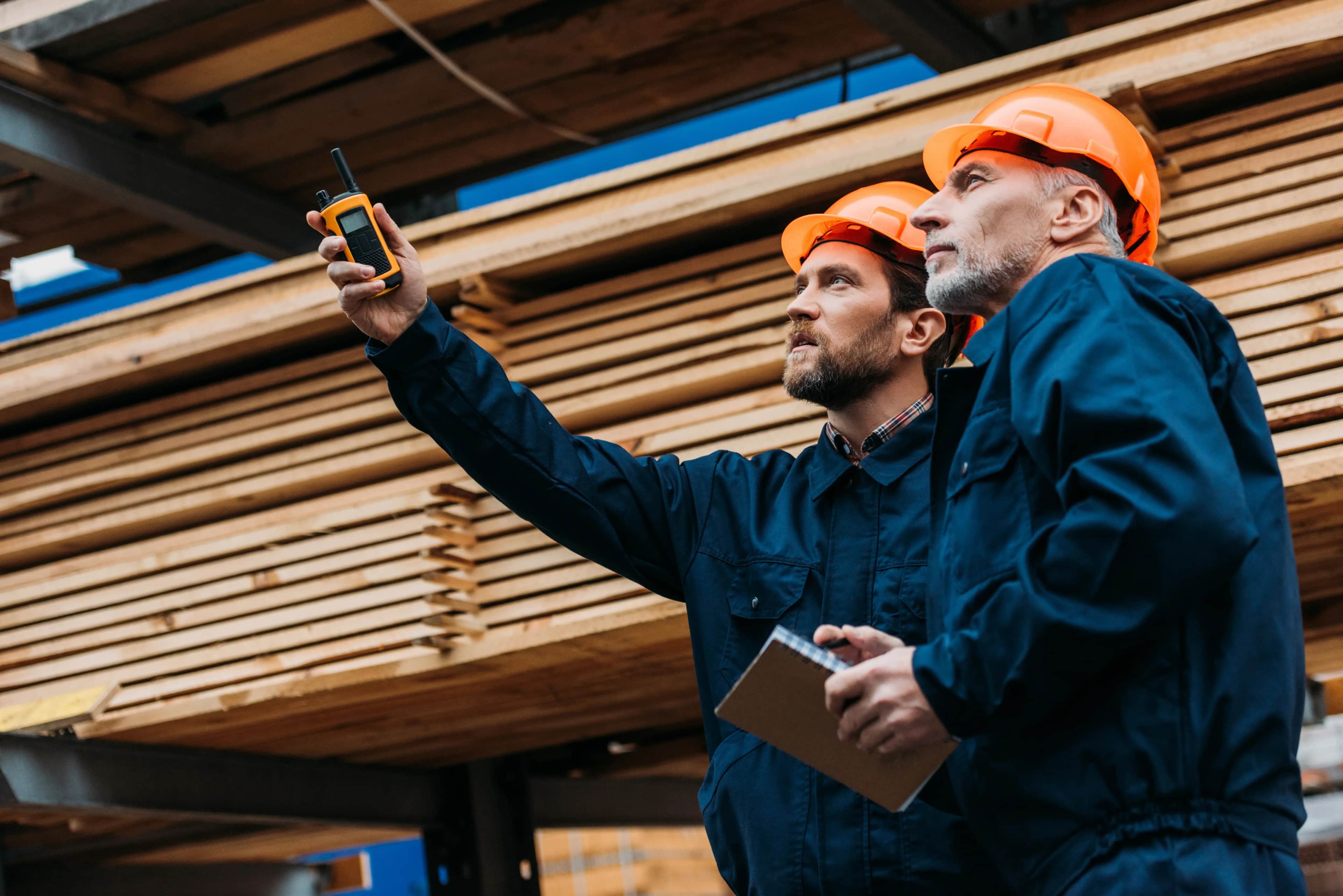 Melbourne tradies on a construction site discussing a job