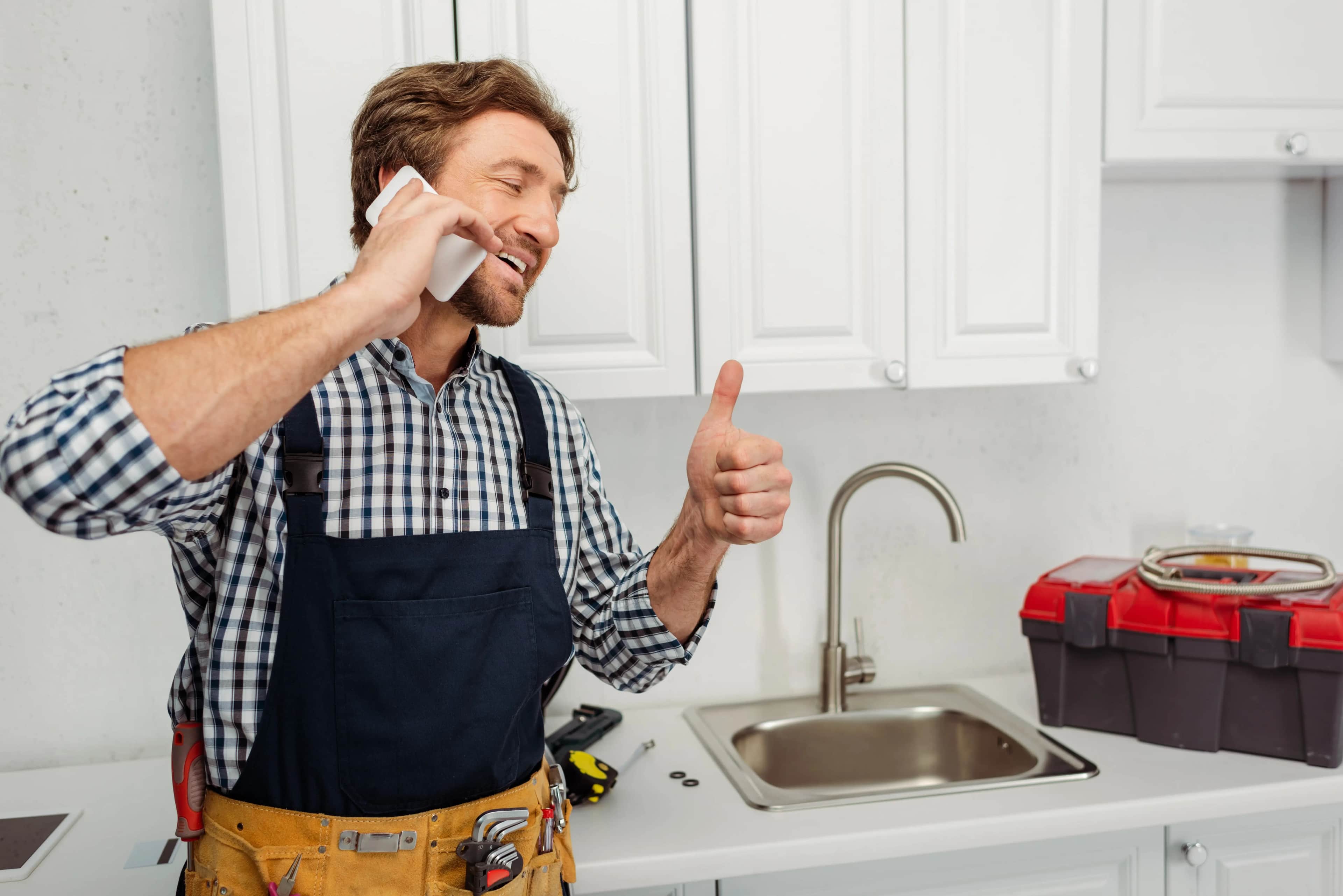 Tradie speaking with a customer after winning the job through his website