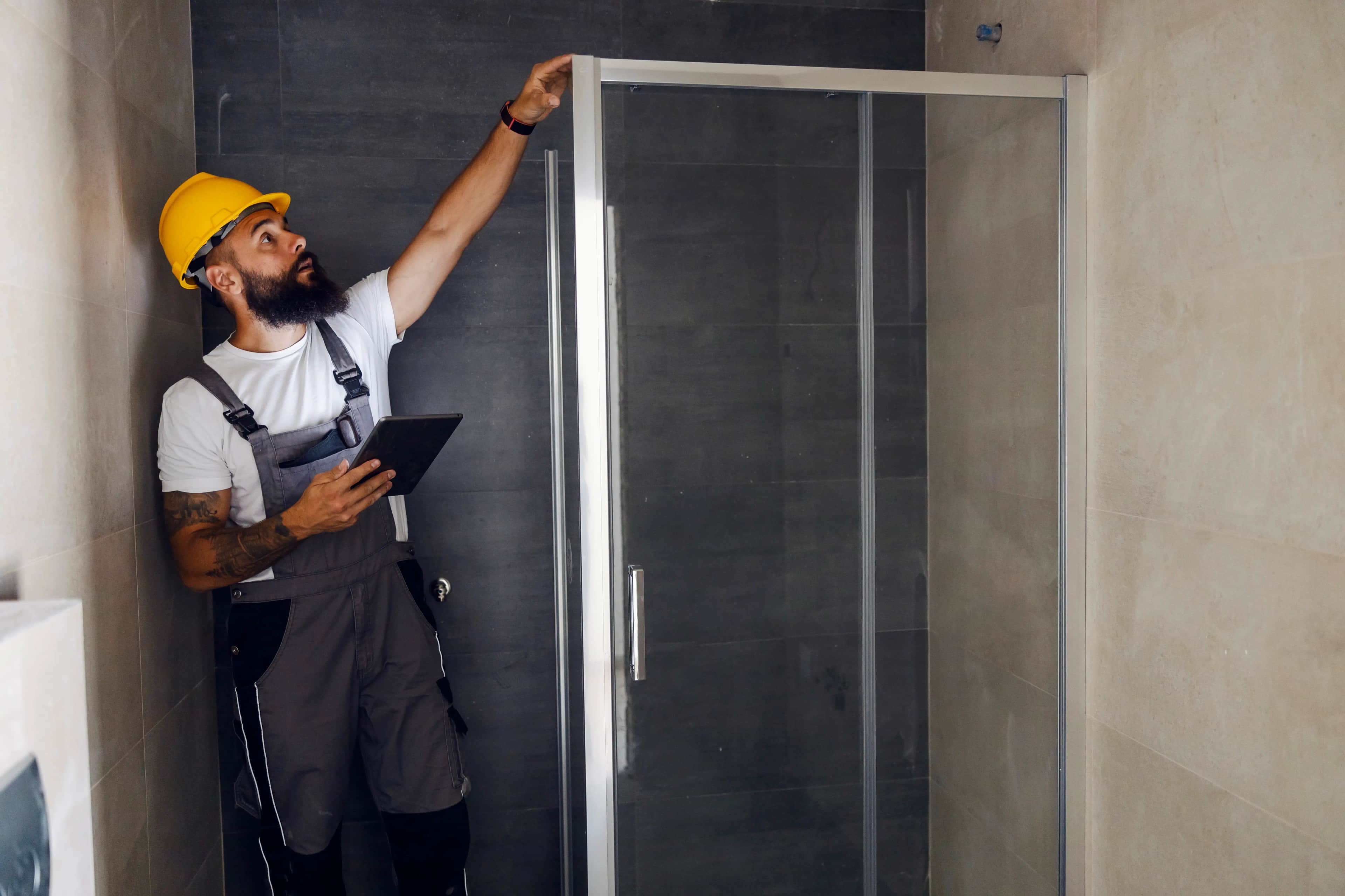 Brisbane tradie checking work on a bathroom renovation